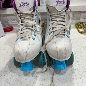 White and Blue Roller Derby Skates